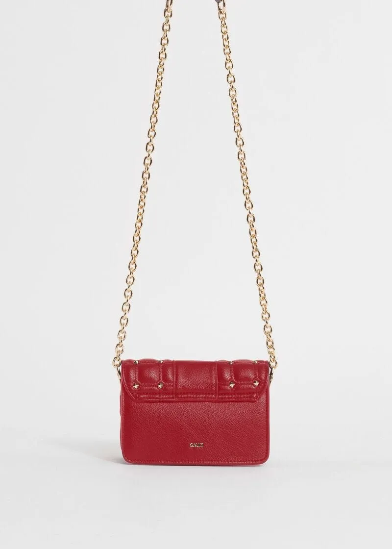Mini crossbody matelassé con borchie
